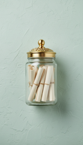 Glass inspirational message jar with gold-accented lid